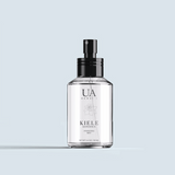 Kiele Gardenia Hydrating Mist in front of blue background