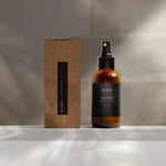'Iliahi Sandalwood Dry Oil in studio background with packaging