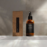 'Iliahi Sandalwood Dry Oil in studio background with packaging