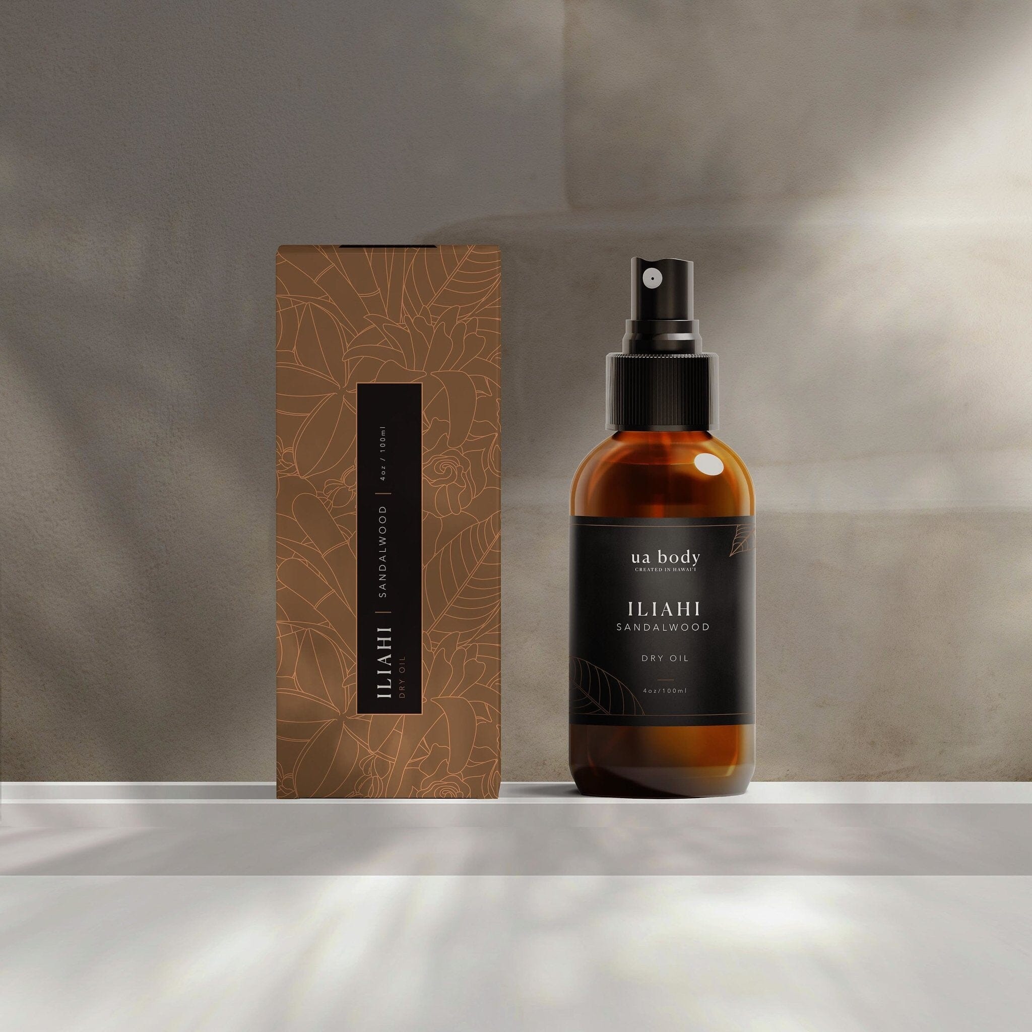 'Iliahi Sandalwood Dry Oil in studio background with packaging
